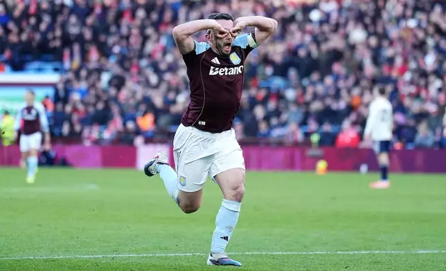 Aston Villa's John McGinn celebrates scoring their side's third goal during their English Premier League soccer match in Birmingham, England, Saturday, Jan. 3, 2026. (Martin Rickett/PA via AP)
