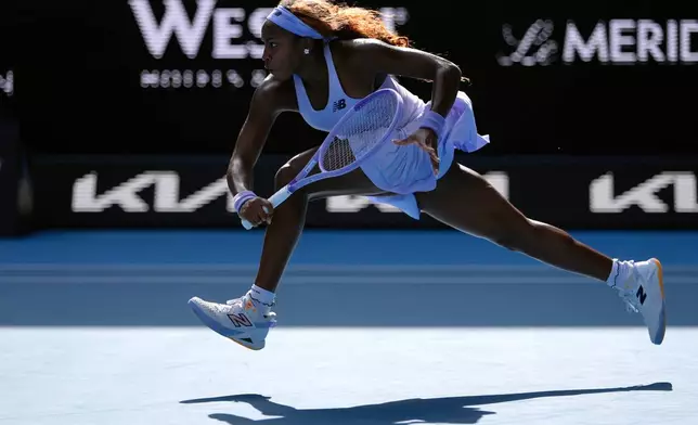 Coco Gauff of the U.S. plays a backhand return to Karolina Muchova of the Czech Republic during their fourth round match at the Australian Open tennis championship in Melbourne, Australia, Sunday, Jan. 25, 2026. (AP Photo/Asanka Brendon Ratnayake)