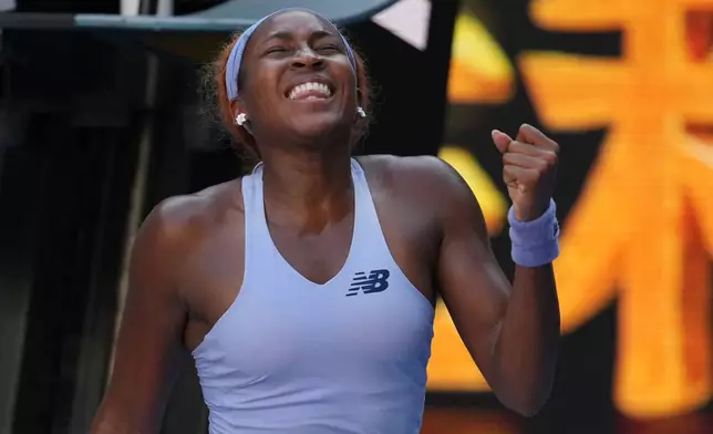Coco Gauff of the U.S. celebrates after defeating Karolina Muchova of the Czech Republic in their fourth round match at the Australian Open tennis championship in Melbourne, Australia, Sunday, Jan. 25, 2026. (AP Photo/Asanka Brendon Ratnayake)
