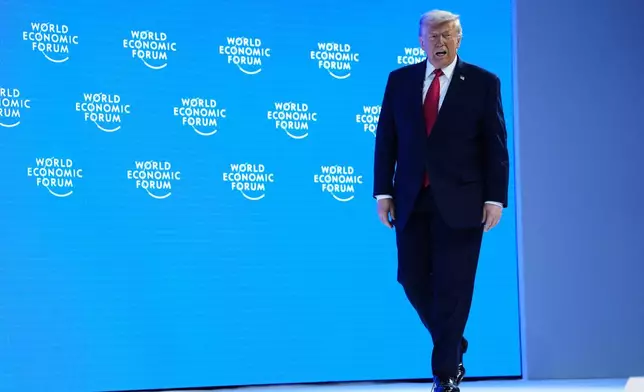 President Donald Trump arrives on stage to address the audience during the Annual Meeting of the World Economic Forum in Davos, Switzerland, Wednesday, Jan. 21, 2026. (AP Photo/Evan Vucci)