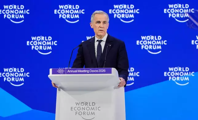 Canada's Prime Minister Mark Carney speaks during the Annual Meeting of the World Economic Forum in Davos, Switzerland, Tuesday, Jan. 20, 2026. (AP Photo/Markus Schreiber)