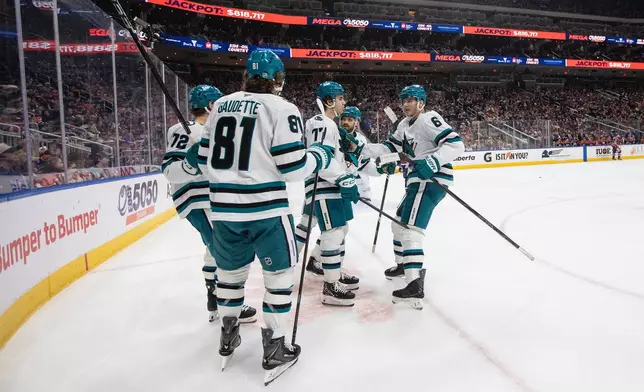 San Jose Sharks players celebrate after a goal against the Edmonton Oilers during first-period NHL hockey game action in Edmonton, Alberta, Thursday, Jan. 29, 2026. (Jason Franson/The Canadian Press via AP)