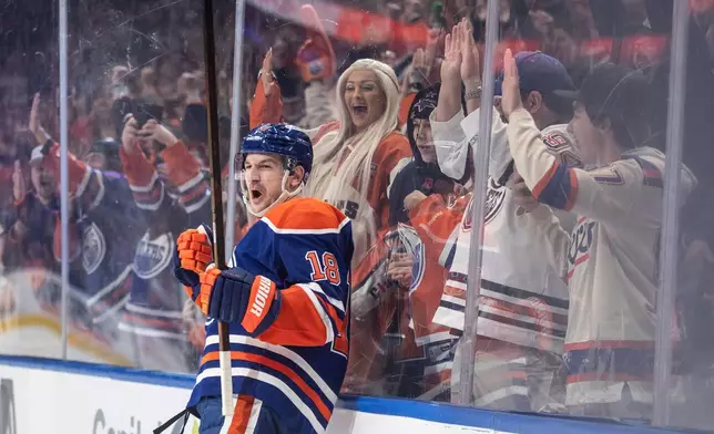Edmonton Oilers' Zach Hyman (18) celebrates a goal against the San Jose Sharks during overtime of an NHL hockey game, in Edmonton, Alberta, Thursday, Jan. 29, 2026. (Jason Franson/The Canadian Press via AP)