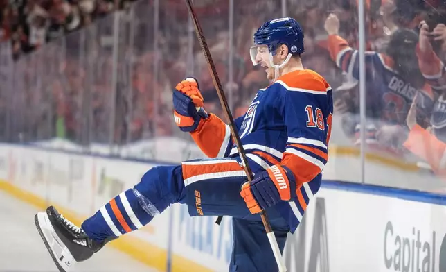 Edmonton Oilers' Zach Hyman celebrates a goal against the San Jose Sharks during overtime of an NHL hockey game, in Edmonton, Alberta, Thursday, Jan. 29, 2026. (Jason Franson/The Canadian Press via AP)