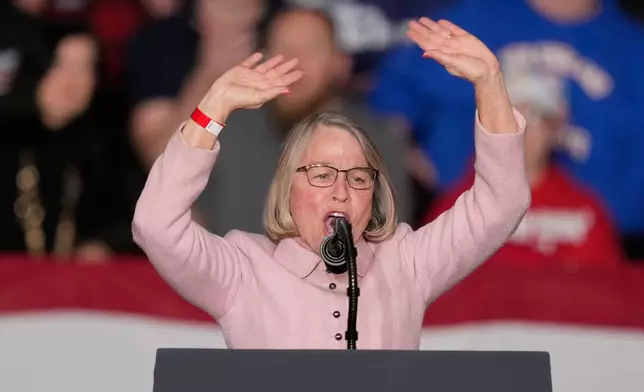 Rep. Mariannette Miller-Meeks, R-Iowa, speaks before President Donald Trump arrives at a rally, Tuesday, Jan. 27, 2026, in Clive, Iowa. (AP Photo/Charlie Neibergall)