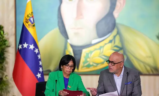 FILE - Venezuelan Vice President Delcy Rodriguez meets with her brother, National Assembly President Jorge Rodriguez at the Foreign Ministry in Caracas, Venezuela, Dec. 11, 2023. (AP Photo/Matias Delacroix, File)