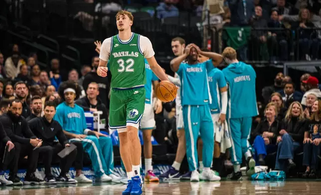 Dallas Mavericks forward Cooper Flagg dribbles the ball during an NBA basketball game against the Charlotte Hornets, Thursday, Jan. 29, 2026, in Dallas. (AP Photo/Jessica Tobias)