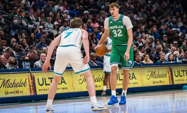 Dallas Mavericks forward Cooper Flagg (32) dribbles during an NBA basketball game against the Charlotte Hornets, Thursday, Jan. 29, 2026, in Dallas. (AP Photo/Jessica Tobias)