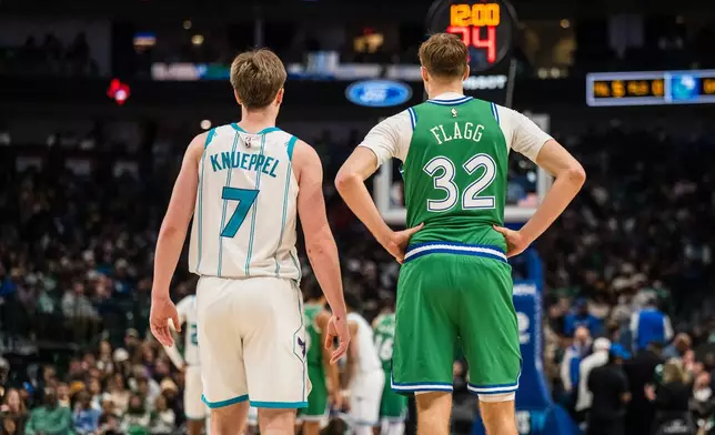 Charlotte Hornets guard Kon Knueppel (7) and Dallas Mavericks forward Cooper Flagg (32) wait for play to start during an NBA basketball game, Thursday, Jan. 29, 2026, in Dallas. (AP Photo/Jessica Tobias)