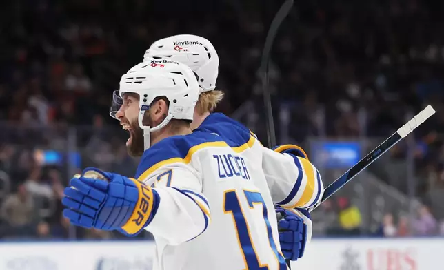 Buffalo Sabres left wing Jason Zucker (17) celebrates his goal during the third period of an NHL hockey game against the New York Islanders, Saturday, Jan. 24, 2026, in Elmont, N.Y. (AP Photo/Heather Khalifa)