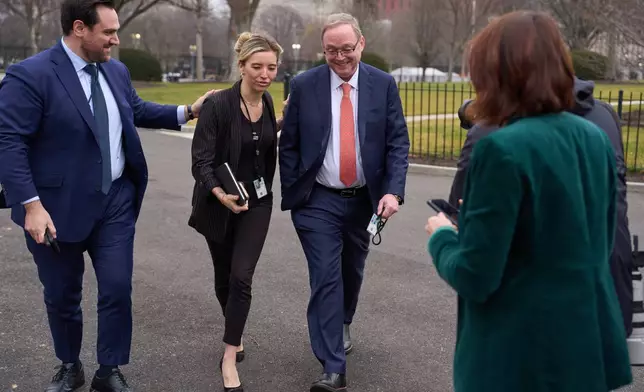 Director of the National Economic Council Kevin Hassett walks past reporters after doing an interview at the White House, Friday, Jan. 9, 2026, in Washington. (AP Photo/Evan Vucci)