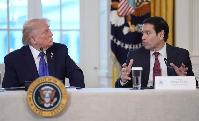 President Donald Trump listens as Secretary of State Marco Rubio speaks during a meeting with oil executives in the East Room of the White House, Friday, Jan. 9, 2026, in Washington. (AP Photo/Evan Vucci)