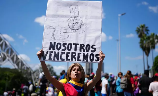 Supporters of the Venezuelan government rally calling for the release of former Venezuelan President Nicolas Maduro and his wife, who were captured by U.S. forces, in Caracas, Venezuela, Friday, Jan. 9, 2026. (AP Photo/Ariana Cubillos)