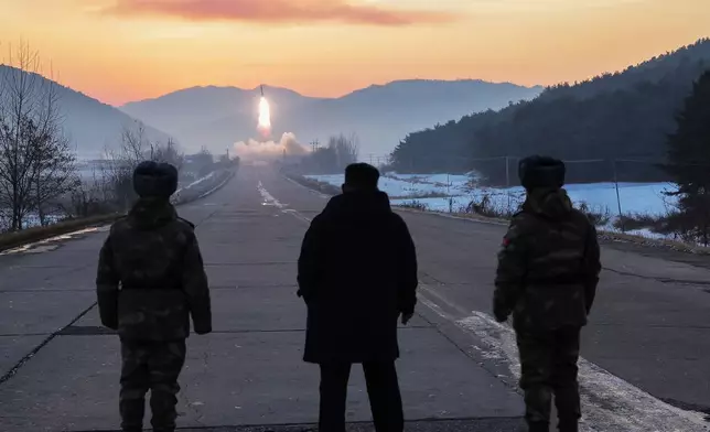 In this photo provided by the North Korean government, leader Kim Jong Un, center, inspects test-flights of hypersonic missiles, in Pyongyang, North Korea, Sunday, Jan. 4, 2026. Independent journalists were not given access to cover the event depicted in this image distributed by the North Korean government. The content of this image is as provided and cannot be independently verified. (Korean Central News Agency/Korea News Service via AP)