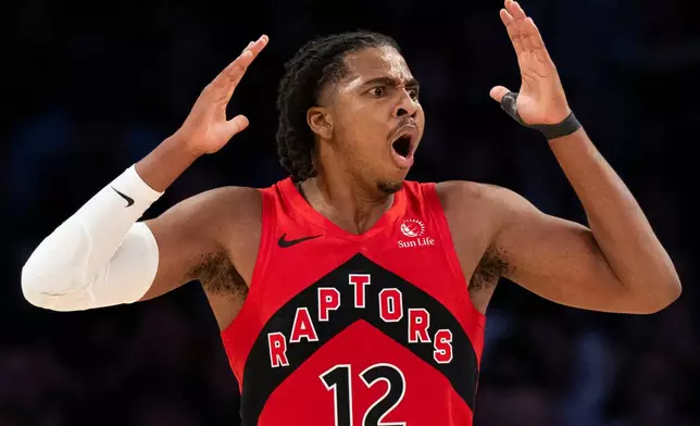 Toronto Raptors forward Collin Murray-Boyles (12) reacts to a call by officials during the first half of an NBA basketball game against the Los Angeles Lakers in Los Angeles, Sunday, Jan. 18, 2026. (AP Photo/Kyusung Gong)