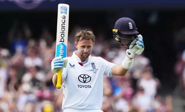 England's Joe Root celebrates after scoring a century during play on day two of the fifth and final Ashes cricket test between England and Australia in Sydney, Monday, Jan. 5, 2026. (AP Photo/Mark Baker)