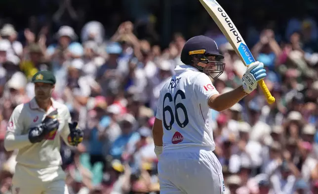 England's Joe Root reacts after scoring 150 runs during play on day two of the fifth and final Ashes cricket test between England and Australia in Sydney, Monday, Jan. 5, 2026. (AP Photo/Mark Baker)