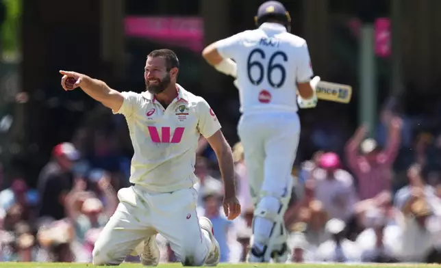 Australia's Michael Neser celebrates after dismissing England's Joe Root during play on day two of the fifth and final Ashes cricket test between England and Australia in Sydney, Monday, Jan. 5, 2026. (AP Photo/Mark Baker)