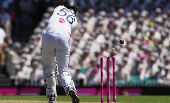 England's Josh Tongue is out bowled during play on day two of the fifth and final Ashes cricket test between England and Australia in Sydney, Monday, Jan. 5, 2026. (AP Photo/Mark Baker)