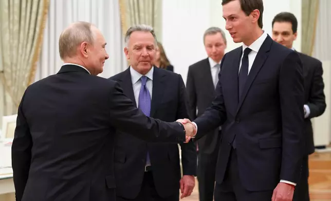 Russian President Vladimir Putin, left, greets U.S. President Donald Trump's envoys Steve Witkoff, center, and Jared Kushner at the Senate Palace of the Kremlin, in Moscow, Thursday, Jan. 22, 2026. (Alexander Kazakov/Sputnik, Kremlin Pool Photo via AP)
