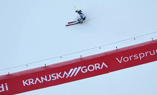 United States' Mikaela Shiffrin speeds down the course during an alpine ski, women's World Cup giant slalom in Kranjska Gora, Slovenia, Saturday, Jan. 3, 2026. (AP Photo/Marco Trovati)