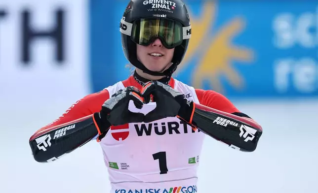 Switzerland's Camille Rast celebrates winning an alpine ski, women's World Cup giant slalom in Kranjska Gora, Slovenia, Saturday, Jan. 3, 2026. (AP Photo/Marco Trovati)