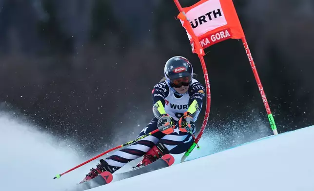 United States' Mikaela Shiffrin speeds down the course during an alpine ski, women's World Cup giant slalom in Kranjska Gora, Slovenia, Saturday, Jan. 3, 2026. (AP Photo/Marco Trovati)
