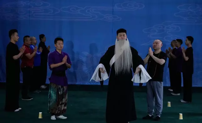 Peking Opera actors rehearse a newly written play at the Jingju Theatre Company in Beijing, China, Friday, Sept. 5, 2025. (AP Photo/Mahesh Kumar A.)