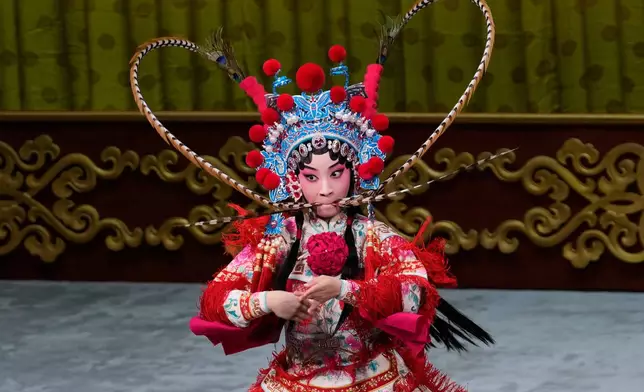 Peking Opera actress Zhang Wanting performs during a show at Jixiang Theatre in Beijing, China, Sunday, Sept. 7, 2025. (AP Photo/Mahesh Kumar A.)