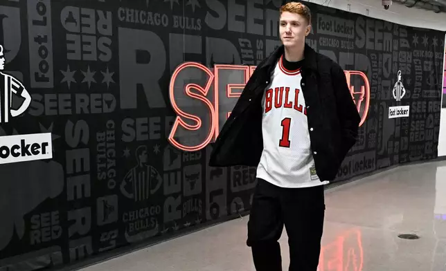 Chicago Bulls guard Kevin Huerter walks into United Center wearing a jersey for former player Derrick Rose before an NBA basketball game against the Boston Celtics, Saturday, Jan. 24, 2026, in Chicago. (AP Photo/Matt Marton)