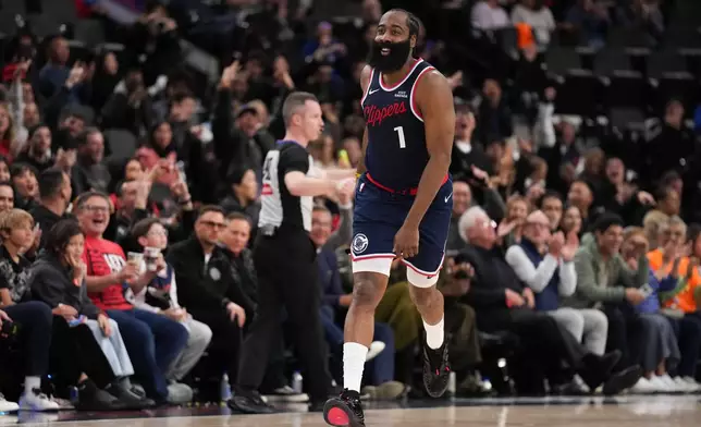Los Angeles Clippers guard James Harden (1) celebrates his three-point basket during the second half of an NBA basketball game against the Charlotte Hornets Monday, Jan. 12, 2026, in Inglewood, Calif. (AP Photo/Jae C. Hong)