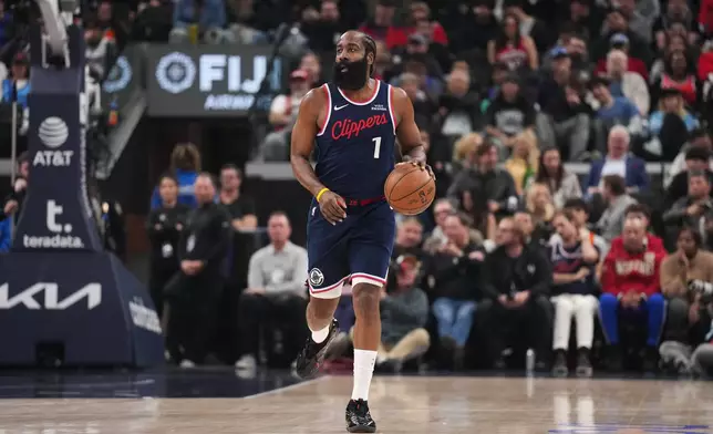 Los Angeles Clippers guard James Harden (1) dribbles during the first half of an NBA basketball game against the Charlotte Hornets Monday, Jan. 12, 2026, in Inglewood, Calif. (AP Photo/Jae C. Hong)