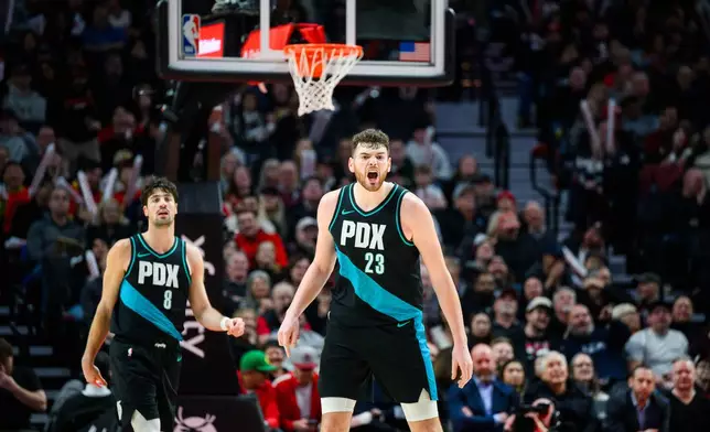 Portland Trail Blazers center Donovan Clingan (23) shouts directions to teammates during the first half of an NBA basketball game against the Utah Jazz, Monday, Jan. 5, 2026, in Portland, Ore. (AP Photo/Molly J. Smith)