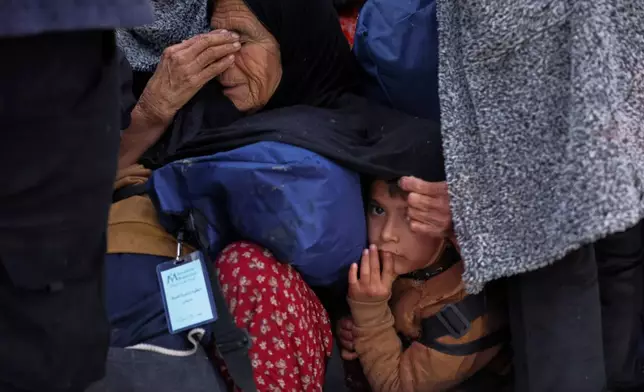 FILE - Displaced residents return to a the Achrafieh neighborhood after days of fighting between government forces and Kurdish fighters in the northern city of Aleppo, Syria, Monday, Jan. 12, 2026. (AP Photo/Ghaith Alsayed)