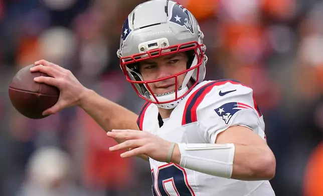 New England Patriots quarterback Drake Maye warms up before the AFC Championship NFL football game between the Denver Broncos and the New England Patriots, Sunday, Jan. 25, 2026, in Denver. (AP Photo/Garrett W. Ellwood)
