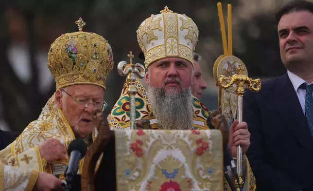 First Primate of Ukrainian Orthodox Church Epiphanius I, center, stands next to Ecumenical Patriarch Bartholomew I, the spiritual leader of the world's Orthodox Christians, during the Epiphany, in Istanbul, Turkey, Tuesday, Jan. 6, 2026. (AP Photo/Francisco Seco)