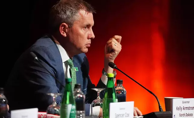 FILE - North Dakota Governor Kelly Armstrong listens to Mark Cuban as he speaks greets during the summer meeting of the National Governors Association at the Broadmoor Hotel in Colorado Springs, Colo., July 25, 2025. (AP Photo/David Zalubowski, File)