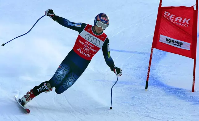 FILE - Bode Miller of the United States makes a turn on one ski during the Downhill portion of the Men's Combined at the World Alpine Ski Championships in Bormio, Italy, Feb. 3, 2005. (AP Photo/Diether Endlicher, File)