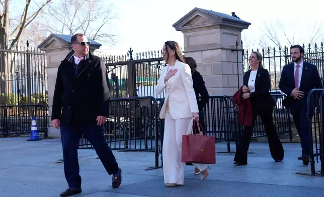 Venezuelan opposition leader María Corina Machado gestures to supporters on Pennsylvania Avenue as she leaves the White House after meeting with President Donald Trump Thursday, Jan. 15, 2026, in Washington. (AP Photo/Pablo Martinez Monsivais)