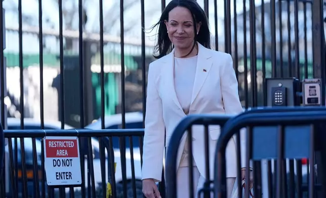 Venezuelan opposition leader María Corina Machado smiles on Pennsylvania Avenue as she leaves the White House after meeting with President Donald Trump Thursday, Jan. 15, 2026, in Washington. (AP Photo/Pablo Martinez Monsivais)