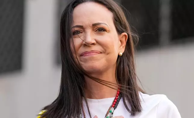 FILE - Opposition leader Maria Corina Machado gestures to supporters during a protest against President Nicolas Maduro the day before his inauguration for a third term, in Caracas, Venezuela, Thursday, Jan. 9, 2025. (AP Photo/Ariana Cubillos, file)
