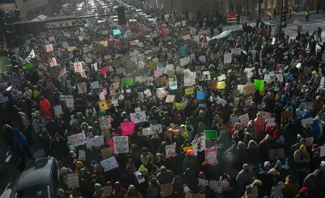 People protest against Federal immigration agents on Friday, Jan. 23, 2026, in Minneapolis. (AP Photo/Angelina Katsanis)