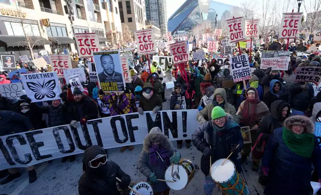 People protest against Federal immigration agents on Friday, Jan. 23, 2026, in Minneapolis. (AP Photo/Angelina Katsanis)