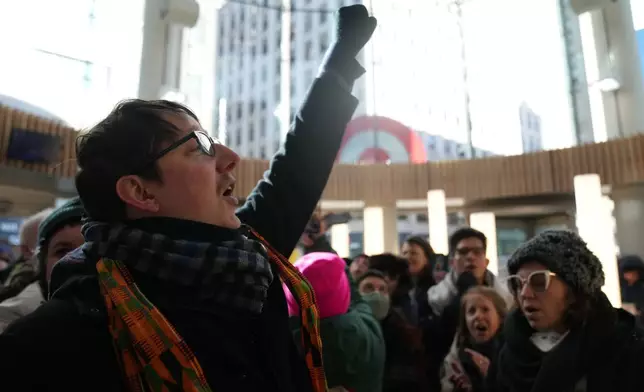 Protesters gather at Target, Friday, Jan. 23, 2026, in Minneapolis. (AP Photo/Abbie Parr)