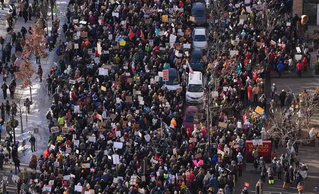 Protesters gather Friday, Jan. 23, 2026, in downtown Minneapolis. (AP Photo/Abbie Parr)