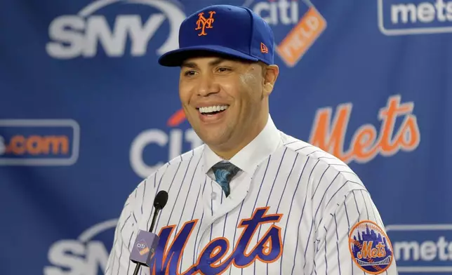FILE - New York Mets' Carlos Beltran smiles during an introductory baseball news conference in New York, Nov. 4, 2019. (AP Photo/Seth Wenig, File)