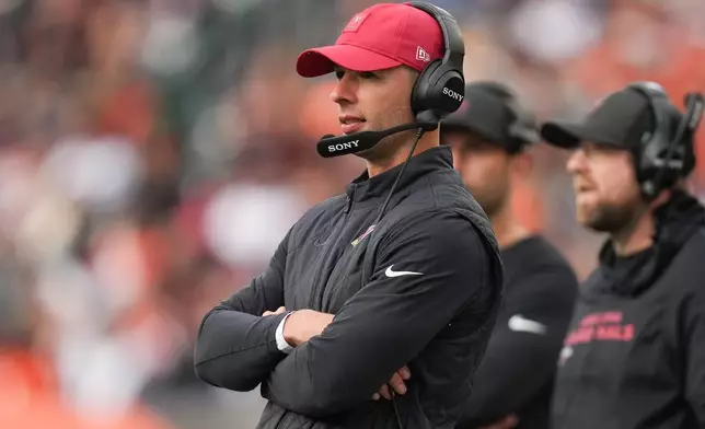 Arizona Cardinals head coach Jonathan Gannon watches from the sideline during the first half of an NFL football game against the Cincinnati Bengals, Sunday, Dec. 28, 2025, in Cincinnati. (AP Photo/Joshua A. Bickel)