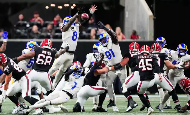Los Angeles Rams linebacker Jared Verse (8) blocks a field goal attempt by Atlanta Falcons place kicker Zane Gonzalez (45), that he returned for a touchdown, in the second half of an NFL football game, Monday, Dec. 29, 2025, in Atlanta. (AP Photo/Brynn Anderson)