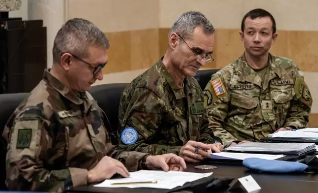 FILE - Members of the committee monitoring the Lebanon-Israel ceasefire, the Head of Mission and Force Commander of the United Nations Interim Force in Lebanon (UNIFIL), Major General Aroldo Lazaro Saenz of Spain, center, US Maj. Gen. Jasper Jeffers, right, and Gen. Guillaume Ponchamp of France, left, meet with Lebanese caretaker Prime Minister Najib Mikati, at the government palace in Beirut, Lebanon, Tuesday, Dec. 24, 2024. (AP Photo/Bilal Hussein, File)