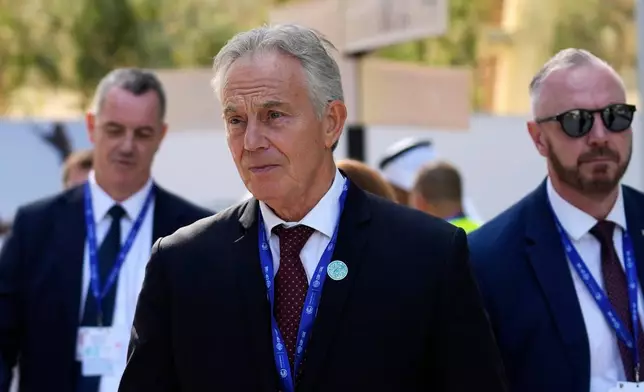 FILE - Britain's former Prime Minister Tony Blair walks through the COP28 U.N. Climate Summit, Sunday, Dec. 3, 2023, in Dubai, United Arab Emirates. (AP Photo/Rafiq Maqbool, file)